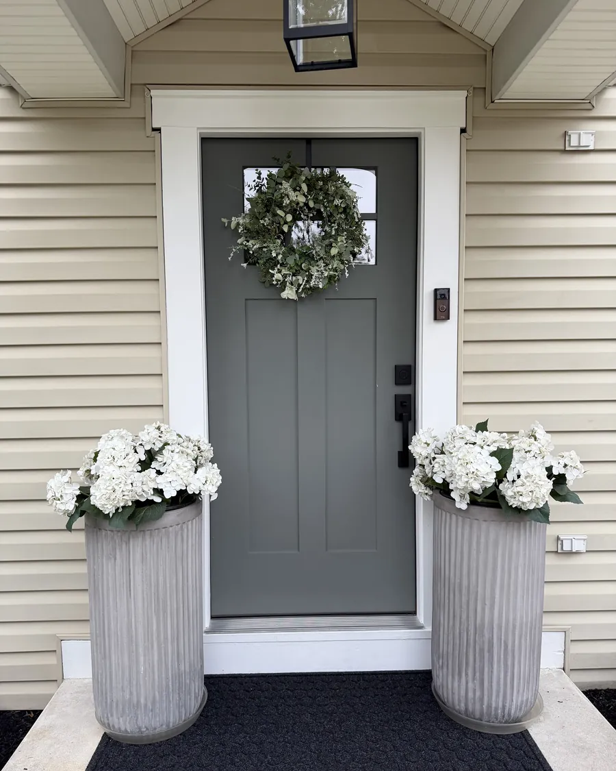 New gray craftsman front entry door installed by Go2 Exteriors