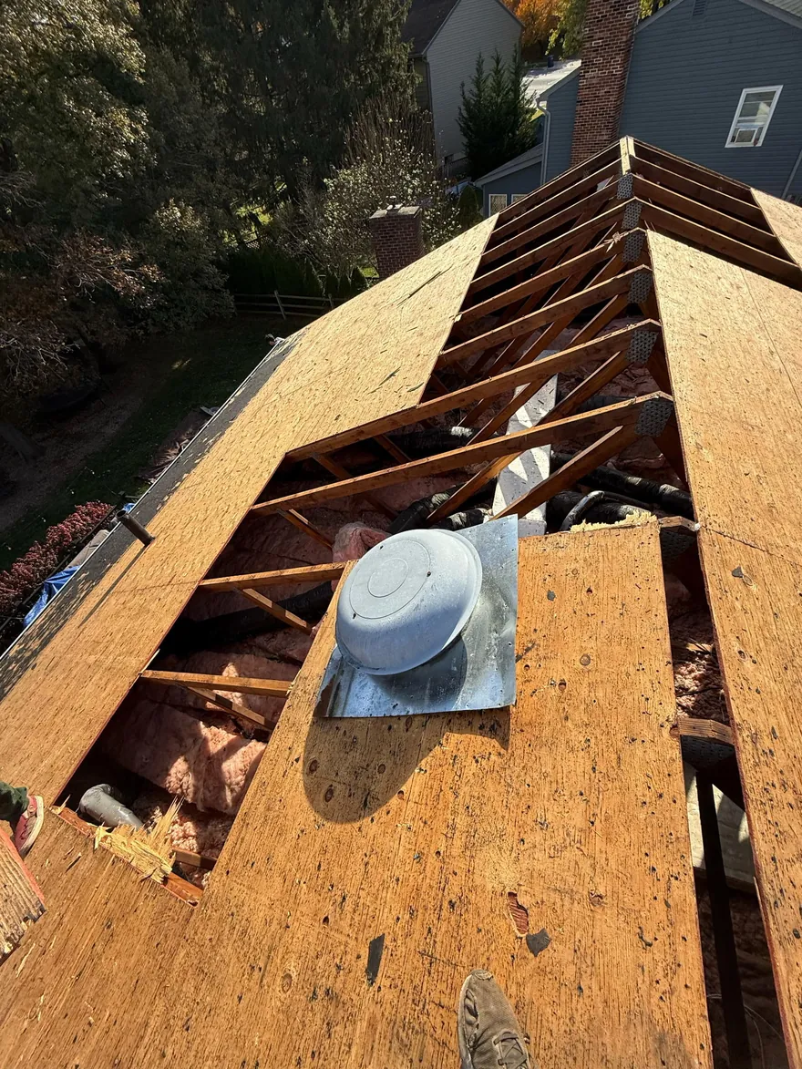 Roof tear-off exposing the wood decking during a Go2 Exteriors roof replacement